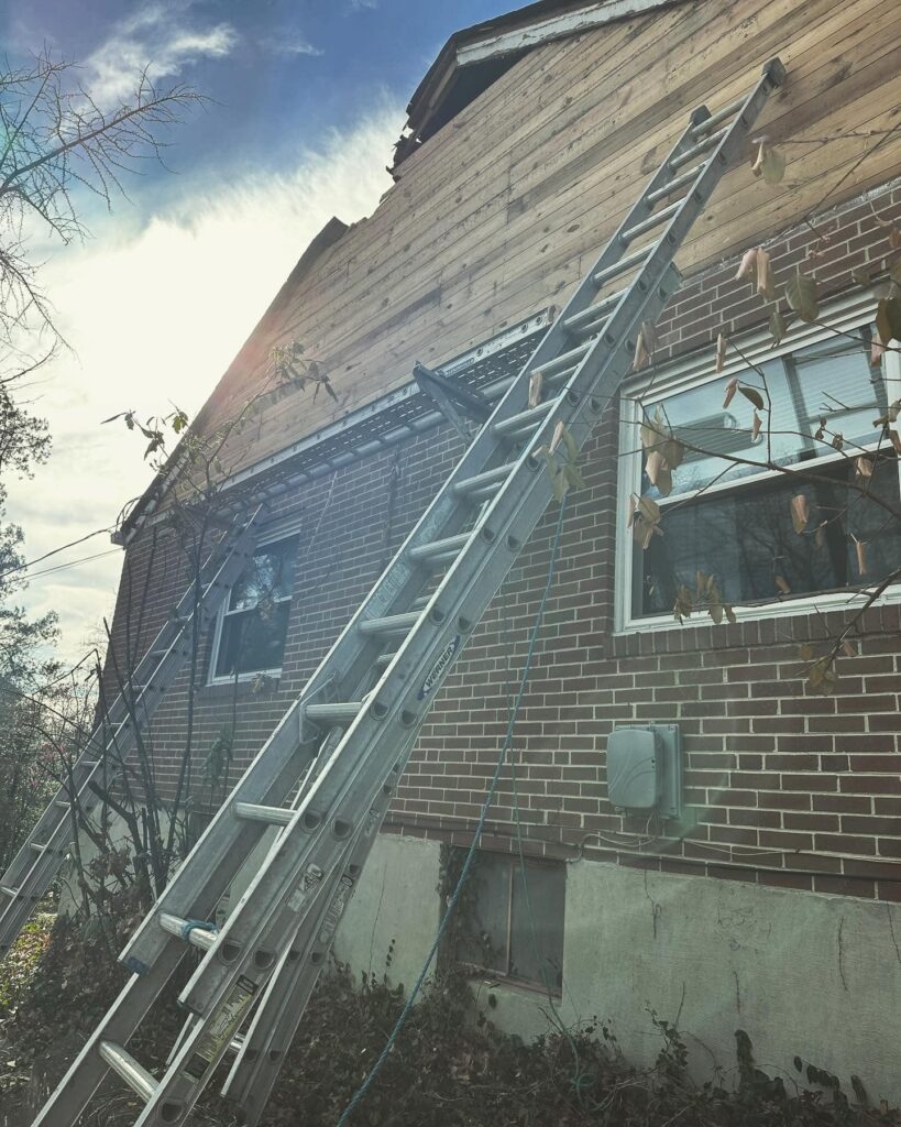 Ladders against house during roof construction